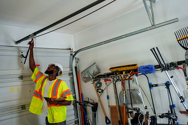 Professional Garage Door Panel Replacement technician working in East Grand Forks, MN